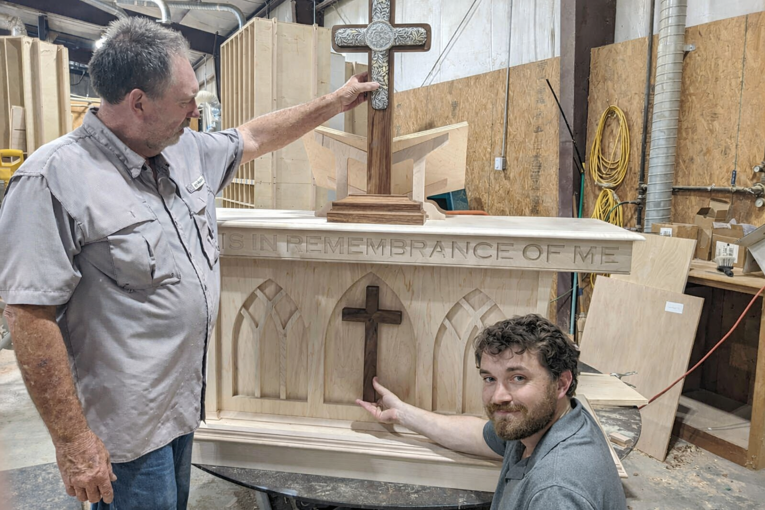 Joe and Chandler Rogers with custom altar in the shop