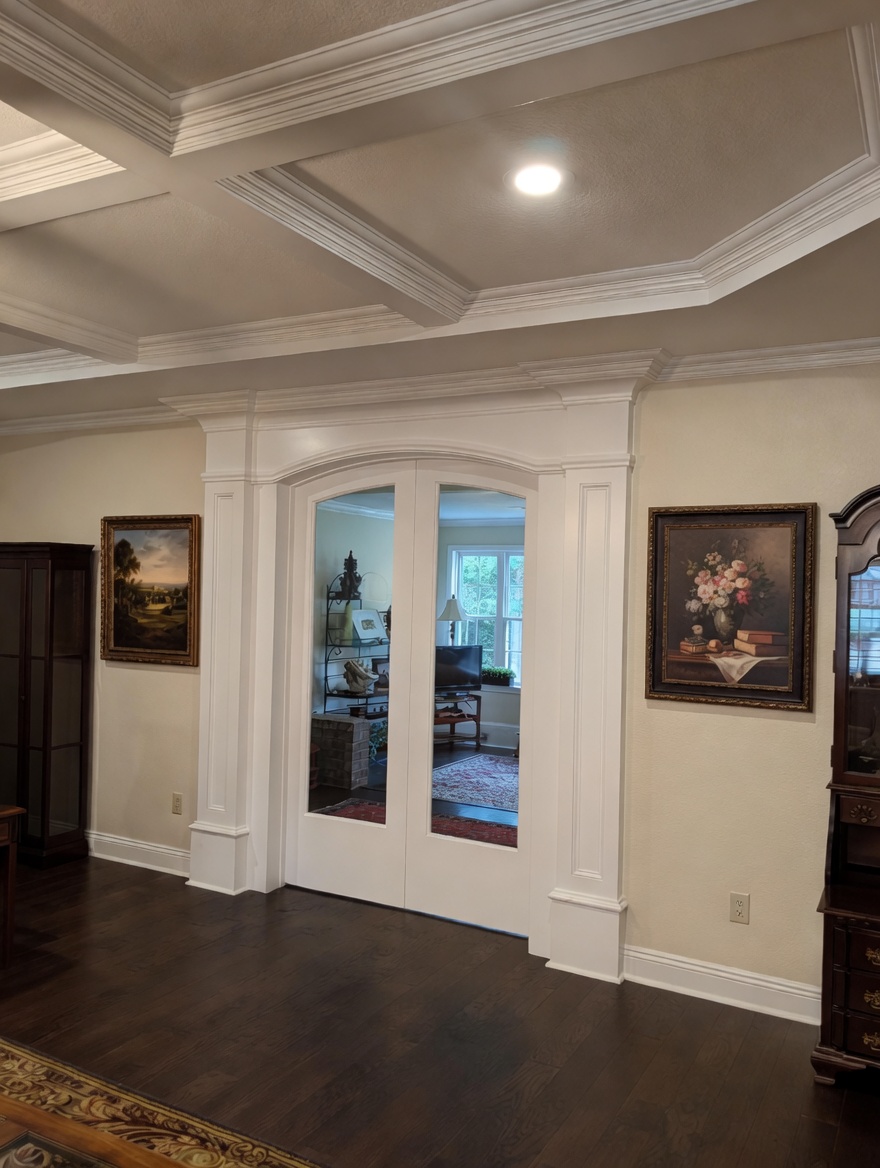 French doors and coffered ceiling